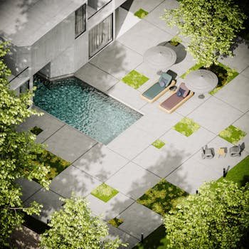 Modern villa with pool, lounge chairs, and patio, surrounded by trees.